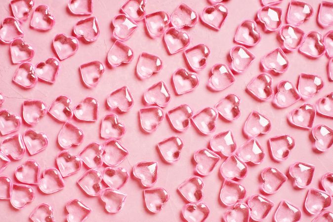 Clear hearts on pink background