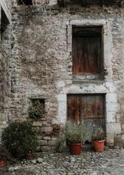 Court between grey stone building