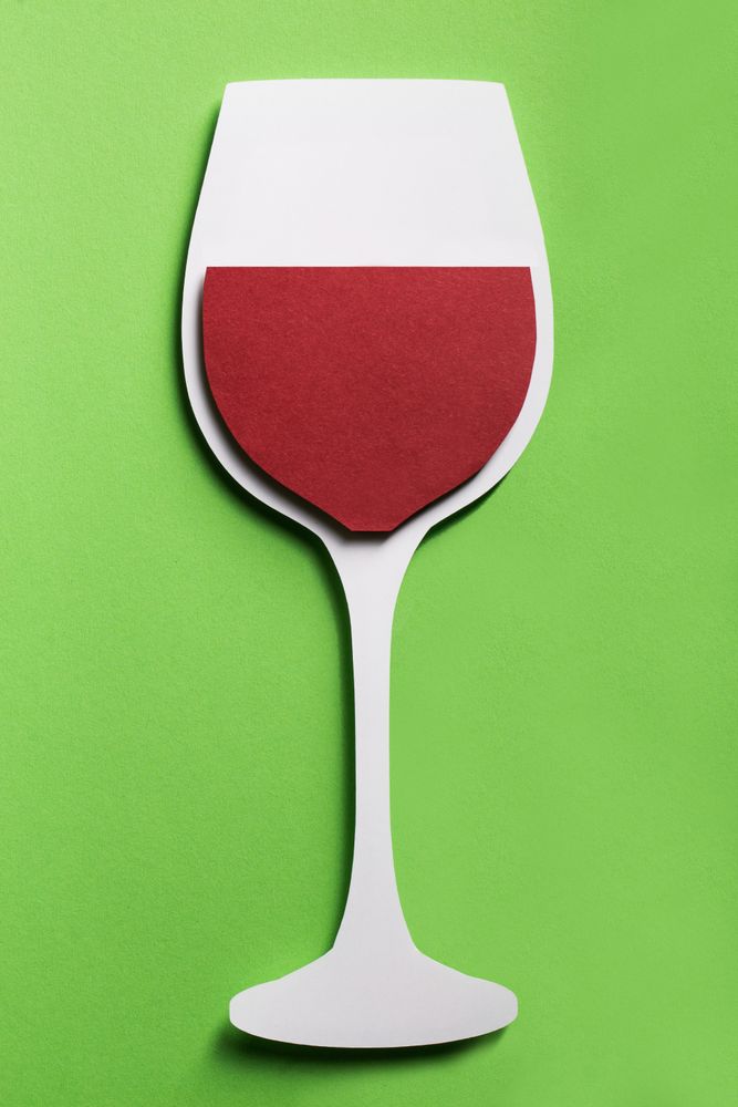 Silhouette of a glass of red wine made with cardboard