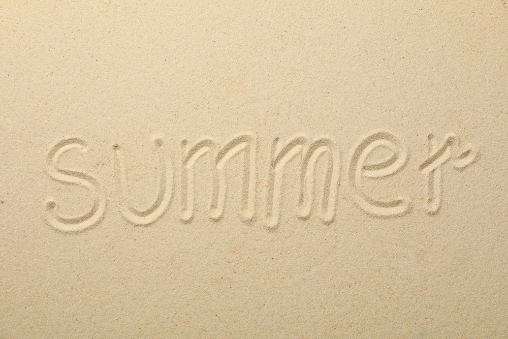 Inscription Summer on sea sand, top view