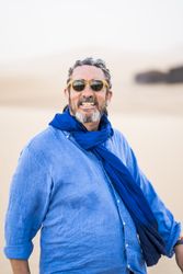 Older man walking in desert