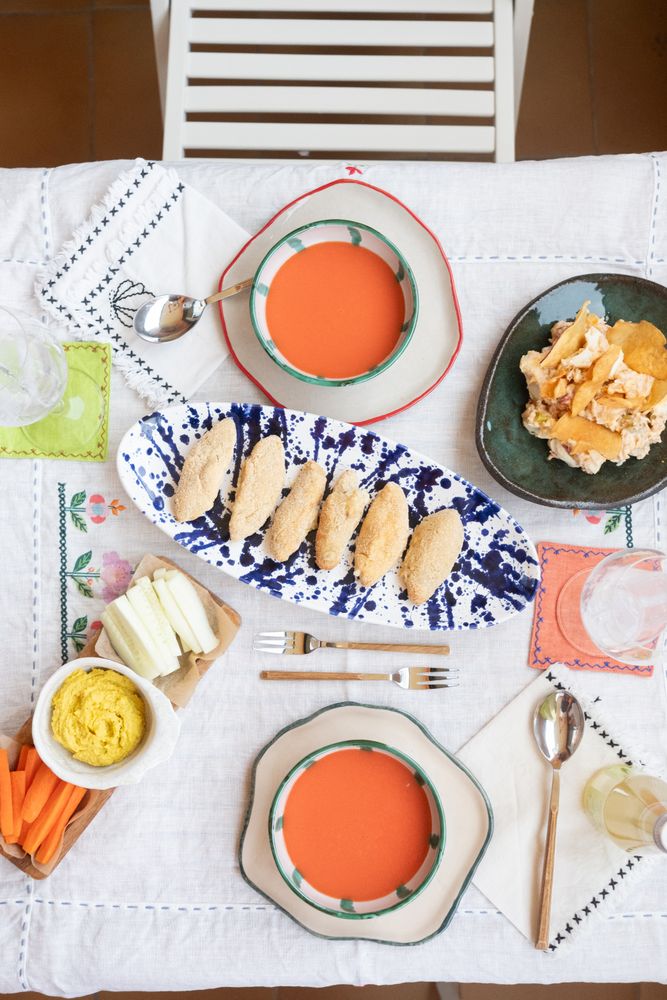 Soup, vegetables, dip and appetizers set on casual table