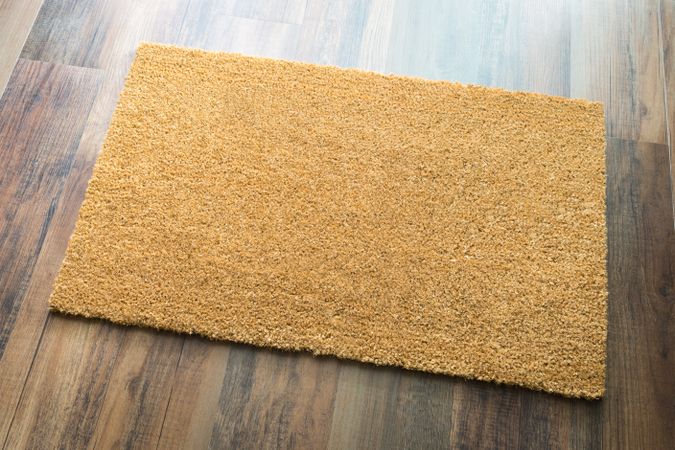 Blank Welcome Mat On Wood Floor Background Ready For Your Own Text