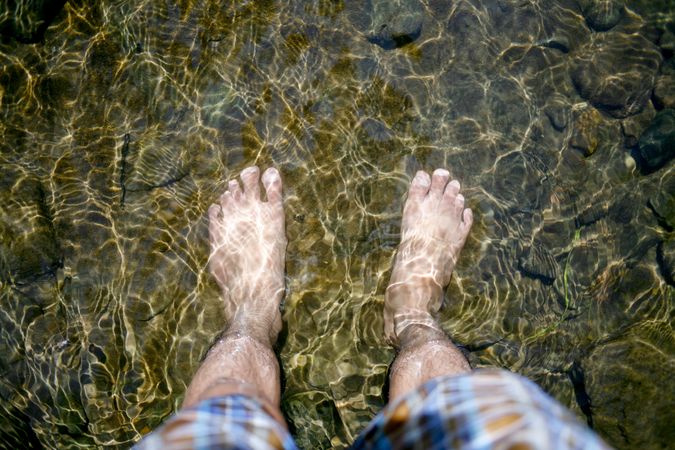 Feet in lake water