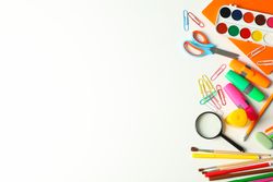 Flat lay composition with school supplies on plain background, space for text