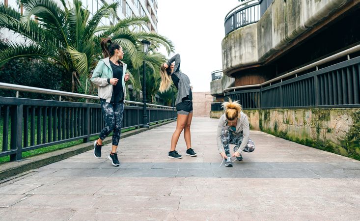 Female runners warming up before running in town