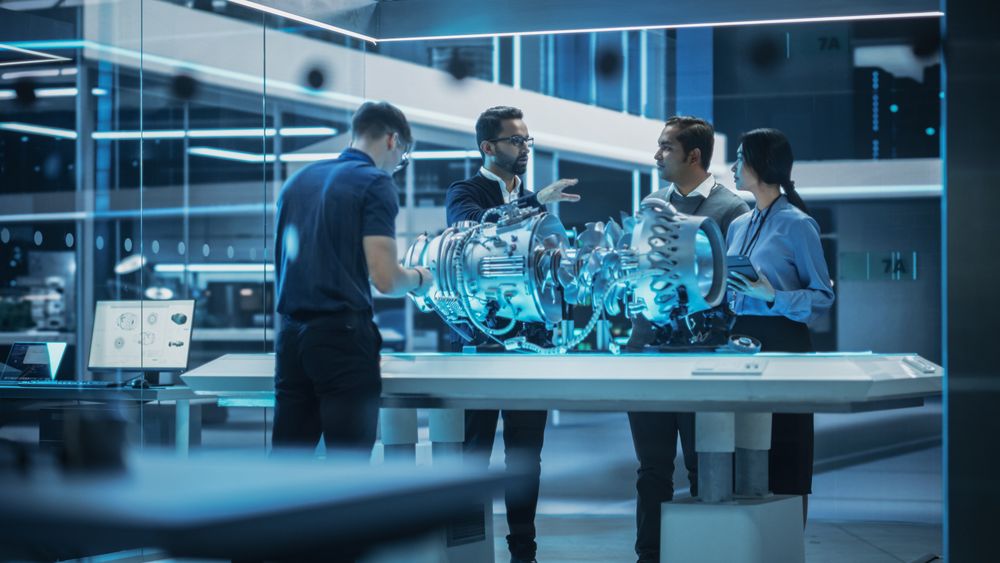 Smart Team of Engineers, Project Manager and Machinery Operators Collaborate on a New Type of a Electric Turbine Engine