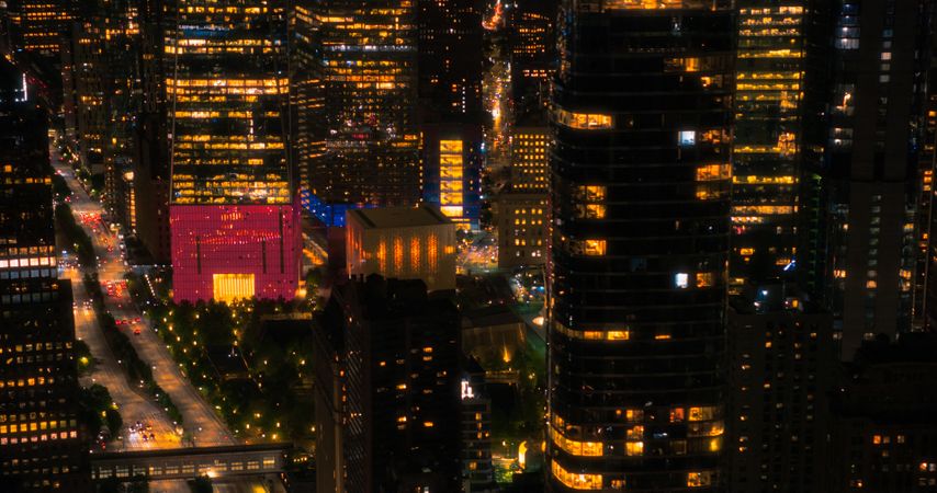 Helicopter Tourist Tour Around New York City at Night. Aerial View with a Picturesque Illuminated Office Buildings, Scenic View with Manhattan Skyscrapers Panorama