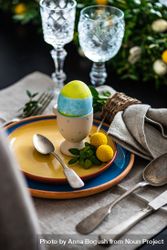 Easter table setting with colorful egg 4jV7j3