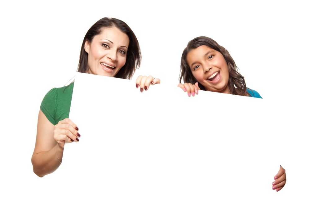 Hispanic Girl and Mother Holding Blank Board