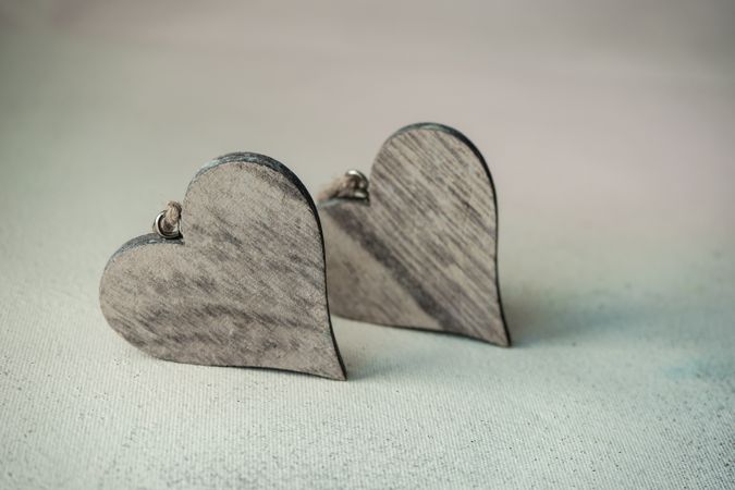 Valentine's day concept with two wooden heart ornaments 