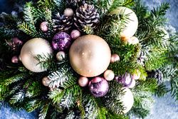 Christmas festive center piece with baubles in pine branches