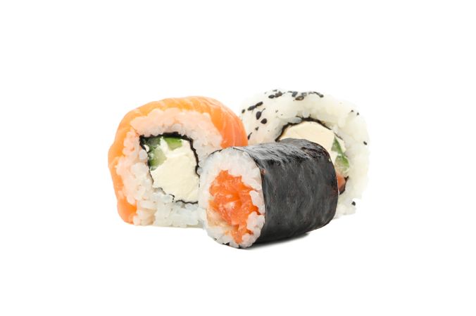Japanese food. Delicious sushi rolls isolated on light background