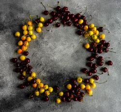 Circle of dark & yellow cherries kitchen counter