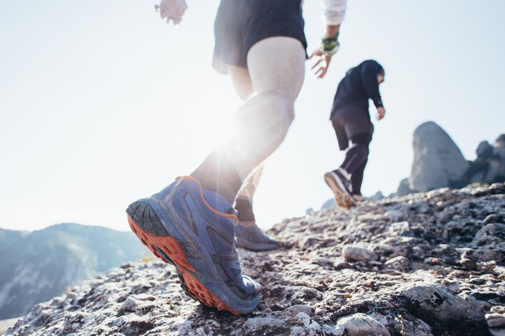 Two men jogging uphill