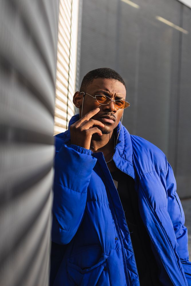 Stylish Black man in sunglasses on street