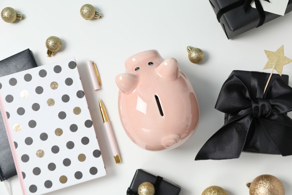 Concept of Christmas finance with piggy bank, top view