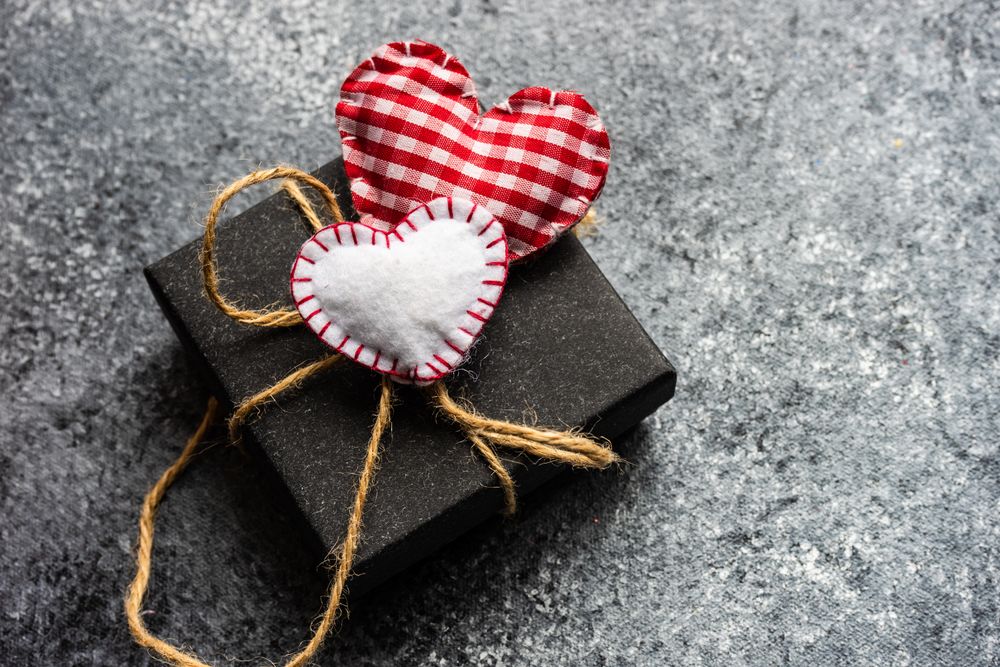 Valentine's day concept with felt hearts on grey counter