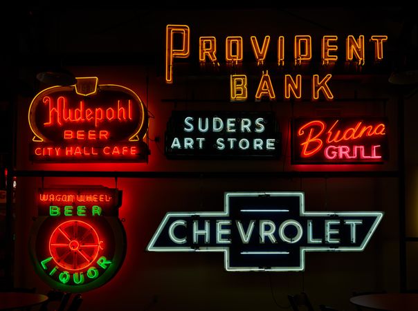An array of signs for banks, cars, restaurants, at the American Sign Museum, Cincinnati, Ohio