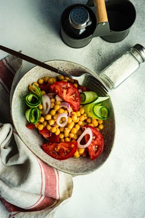 Top view of healthy salad with organic vegetables and chickpeas