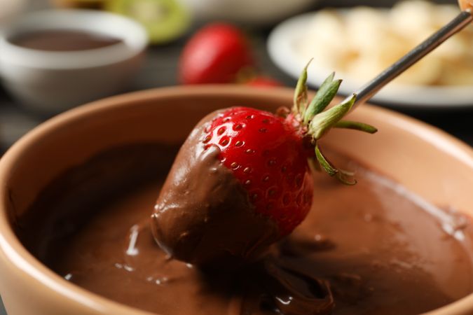Strawberry in chocolate, close up. Chocolate fondue