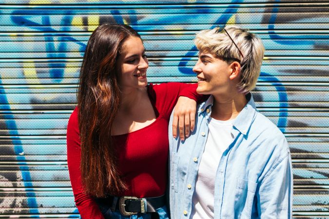 portrait of two young women looking at each other