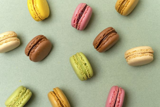 Above view of various macaroons on a marble background