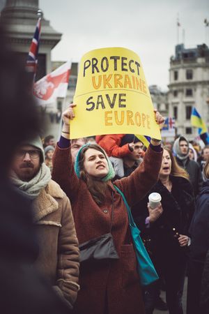 London, England, United Kingdom - March 5 2022: Woman with “Protect Ukraine Save Europe” sign