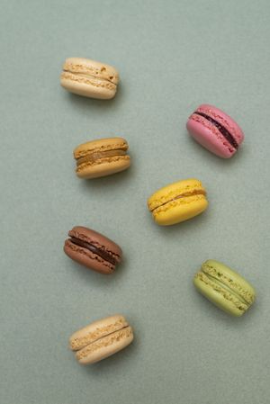 Above view of scattered macaroons on a kitchen counter