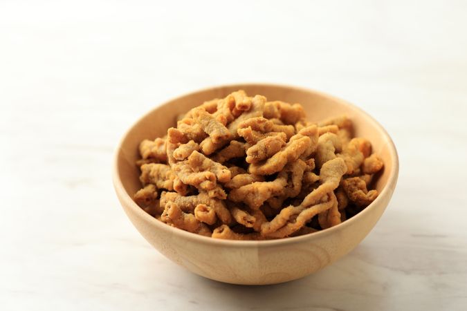 Crispy Fried Chicken Intestines in a Wooden Bowl