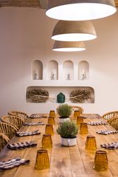 Served table with burning lamps above