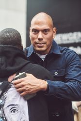 London, England, United Kingdom - September 18 2021: Man embracing other man