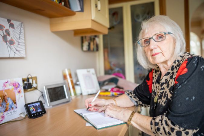 Woman writing at home