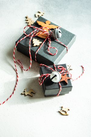Christmas gift boxes with holiday decor on stone background with copy space
