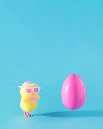 Plastic pink egg with yellow chick