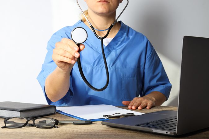 A stethoscope in the hands of a doctor