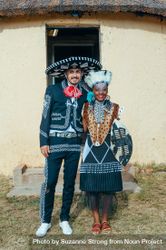 Zulu bride with her groom in traditional Mexican outfit m pose for wedding photo 0V6gX0