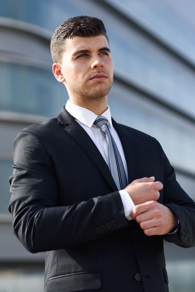 Man adjusting his sleeves