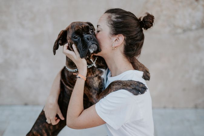 Young woman hugging with spot dog