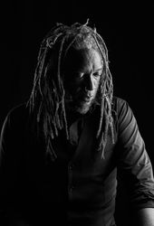 Grayscale photo of man looking down