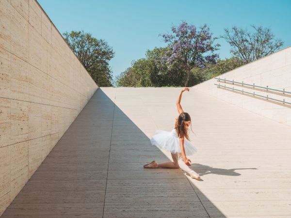 Ballerina performing classical position outside