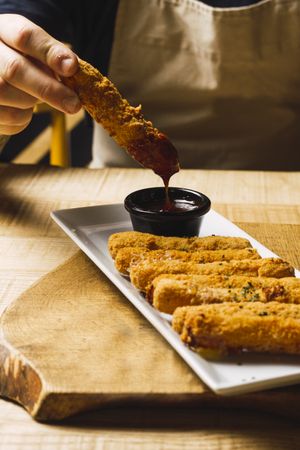 Chicken fried sticks and red sauce