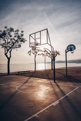 Basketball court on shore of ocean