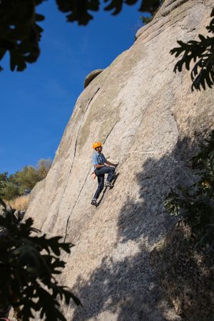 Free climber climbing in nature