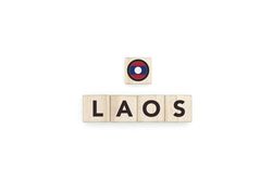 Wooden blocks bearing the name and flag of Laos.