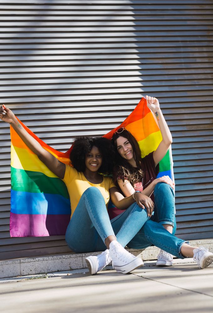 Women couple with LGBT flag