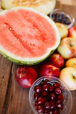 Delicious summer fruits on wooden table