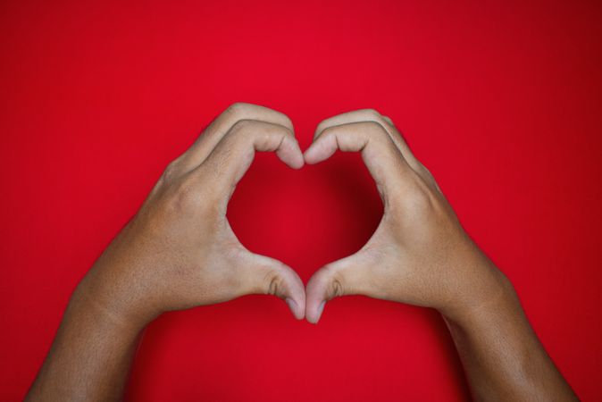 love gesture on red background