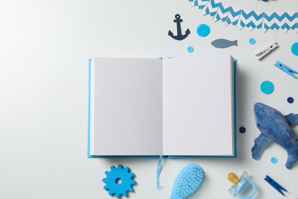 Blue children's book, with toys, on a light background.