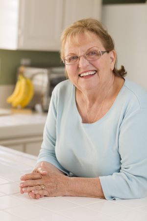 Portrait of Beautiful Older Adult Woman in Kitchen